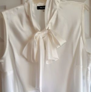 Ivory satin blouse with bow tie.